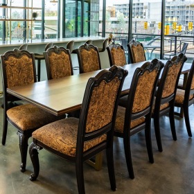 a large room with a table and chairs