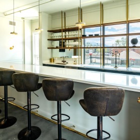 a bar with chairs and a table