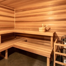 a wooden room with a bench